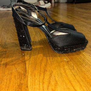 Black heels with black sparkles on heel. Size 8. Worn once.